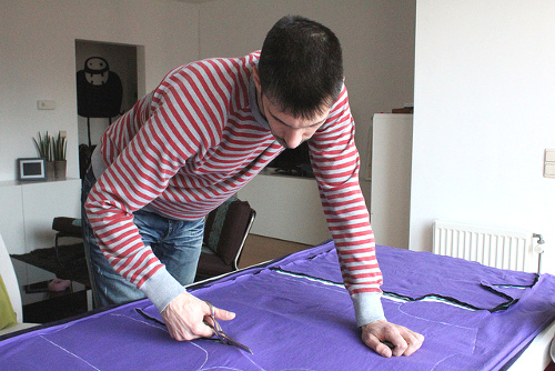 Joost cutting out some T-shirts